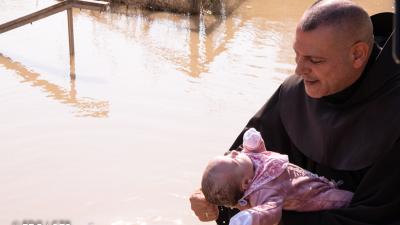 Fr. Mario Maria Hadchiti, on the banks of the Jordan River, at the site of Qasr Al-Yahud